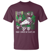 Maroon garden skeleton graphic T-shirt with plants and “Home Is Where My Plants Are” text