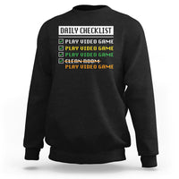 Black gamer sweatshirt with “Daily Checklist” and play video game checklist graphic