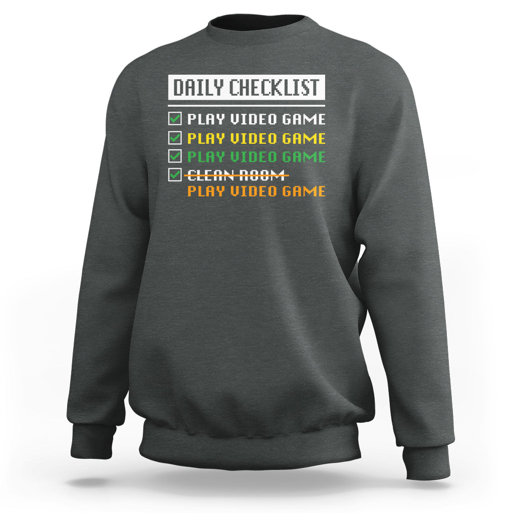 Dark heather gamer sweatshirt with “Daily Checklist” and play video game checklist graphic