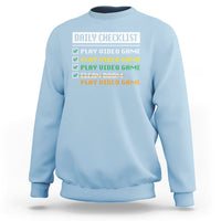 Light blue gamer sweatshirt with “Daily Checklist” and play video game checklist graphic