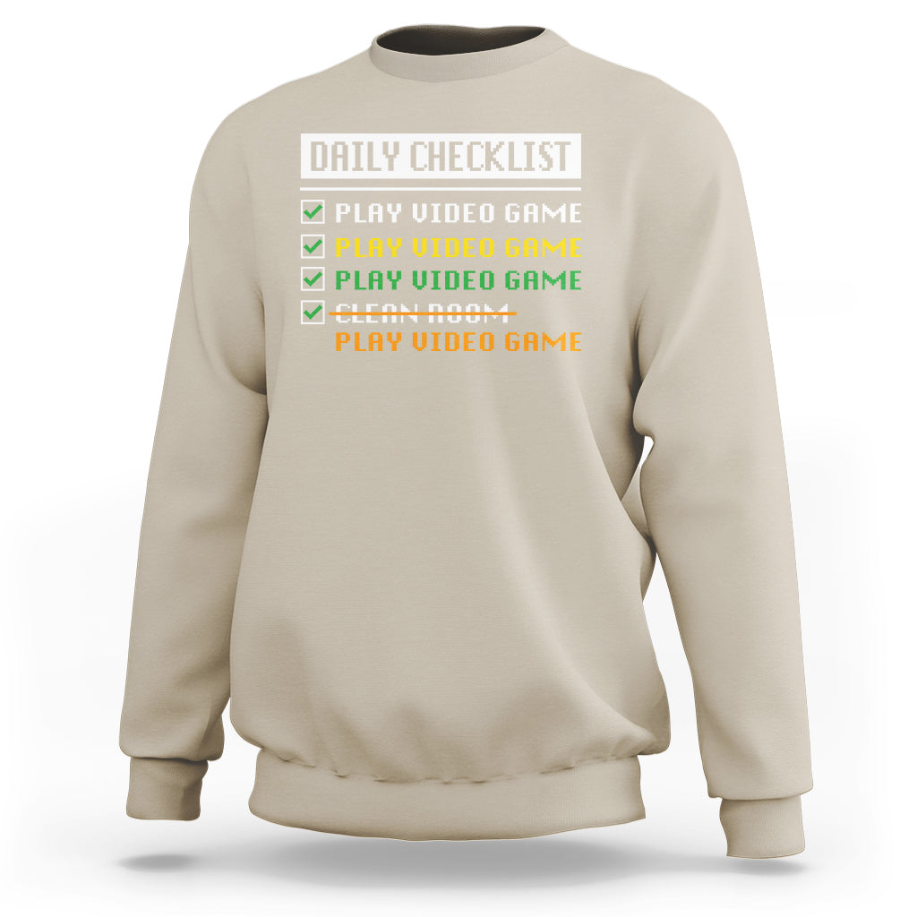 Sand gamer sweatshirt with “Daily Checklist” and play video game checklist graphic