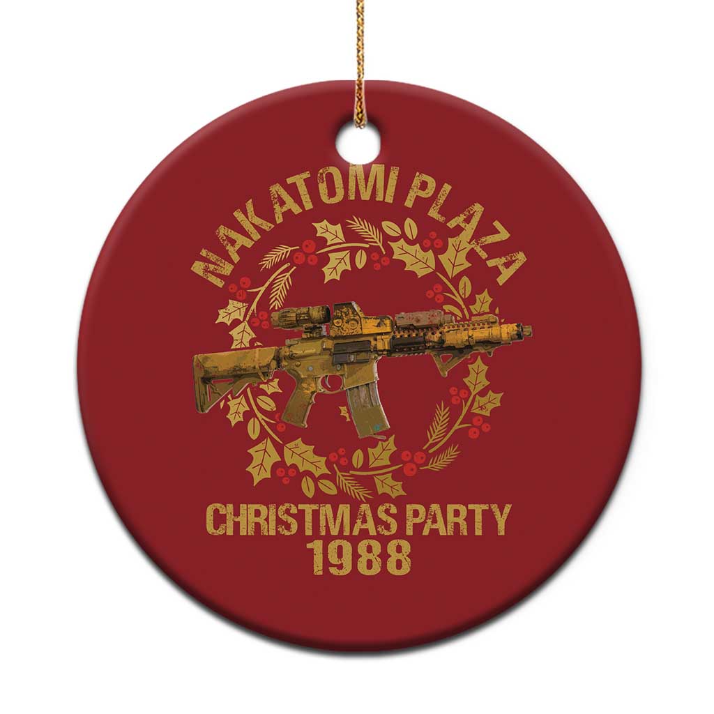 Red round Christmas ornament with gold Nakatomi Plaza “Christmas Party 1988” print and hanging cord.