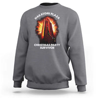 Charcoal gray sweatshirt with front “Christmas Party Survivor” graphic and NAKATOMI PLAZA logo