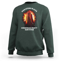 Dark forest green sweatshirt with front “Christmas Party Survivor” graphic and NAKATOMI PLAZA logo