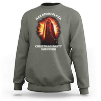Military green sweatshirt with front “Christmas Party Survivor” graphic and NAKATOMI PLAZA logo