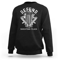 Black crewneck sweatshirt with white Defend graphic and Nakatomi Plaza text