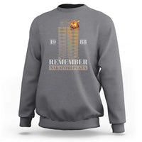 Charcoal gray crewneck sweatshirt with back print: "Remember Nakatomi Plaza" and "19 88"