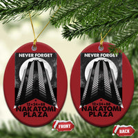 Two red oval Christmas ornaments with building graphic and “Never Forget Nakatomi Plaza”