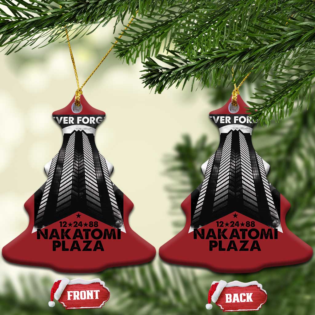 Pair of red bell-shaped Christmas ornaments with building graphic and “Never Forget Nakatomi Plaza”