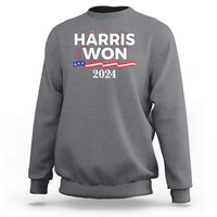 Charcoal gray crewneck sweatshirt with front “HARRIS WON 2024” graphic and stars stripes
