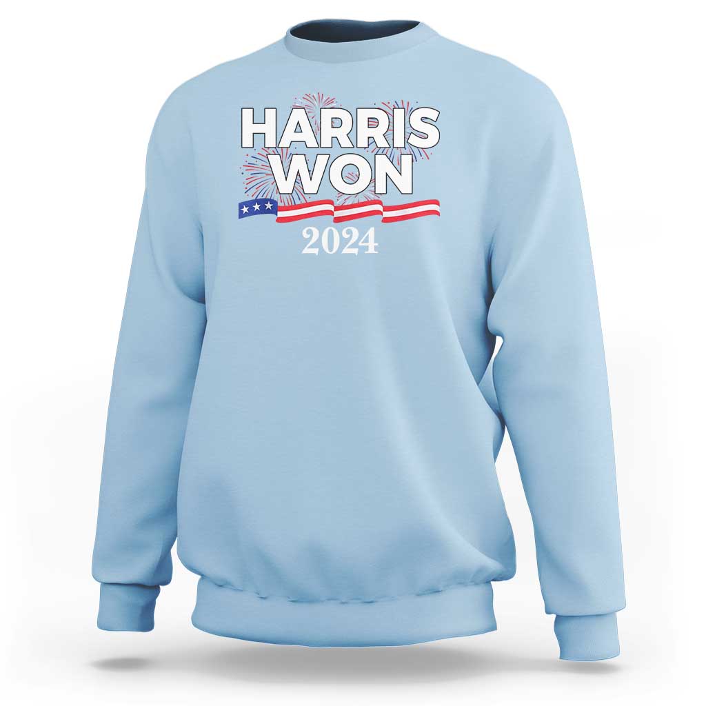 Light blue crewneck sweatshirt with front “HARRIS WON 2024” graphic and stars stripes