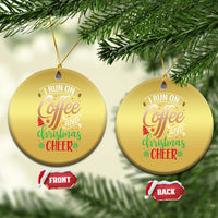 Two gold round Christmas ornaments with “I RUN ON Coffee and Christmas Cheer” text
