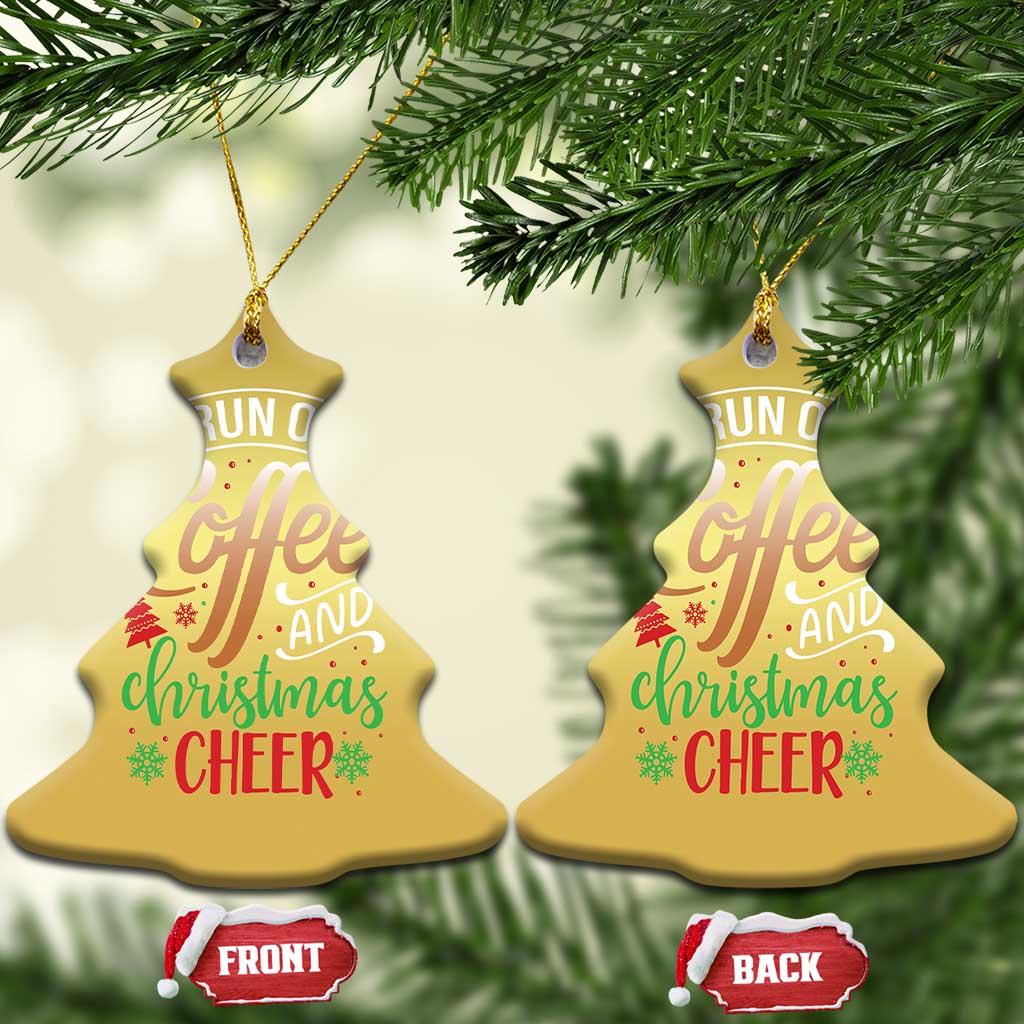Two gold bell-shaped Christmas ornaments with “I RUN ON Coffee and Christmas Cheer”