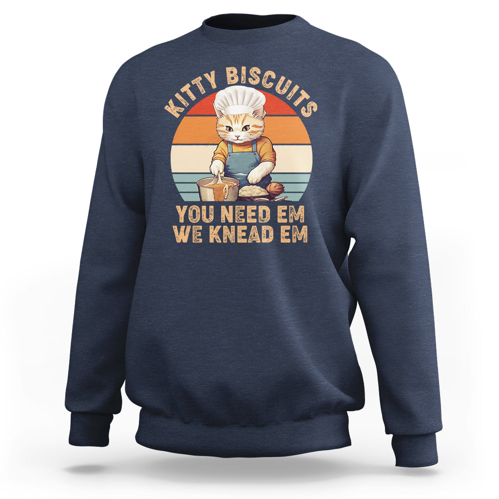 Navy crewneck sweatshirt with vintage kitty graphic and striped badge on the chest.