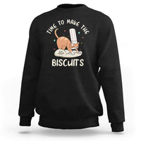Black crewneck sweatshirt with cute cat holding a spatula and biscuit graphic on chest