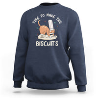 Navy crewneck sweatshirt with cute cat holding a spatula and biscuit graphic on chest