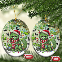 Two round green cat Christmas ornaments with Santa hat and “Everything I’m Fine Is Fine”