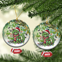 Round green cat Christmas ornaments hanging on tree, “Everything I’m Fine Is Fine” text