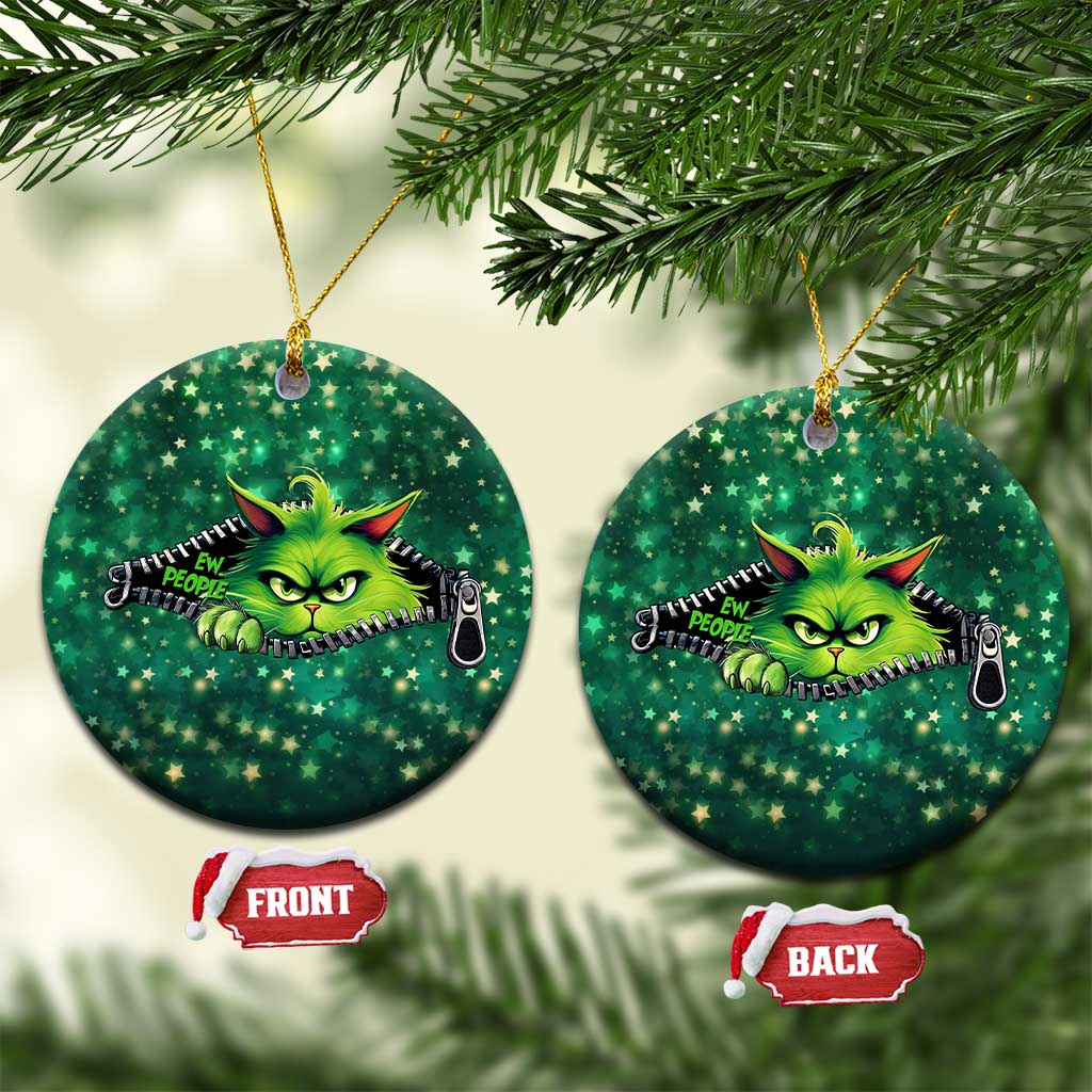 Pair of green circular cat Christmas ornaments with cartoon neon cat face, hanging on hooks.