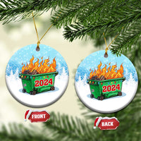 Pair of round blue ornaments showing green dumpster fire and red 2024; front and back tags.