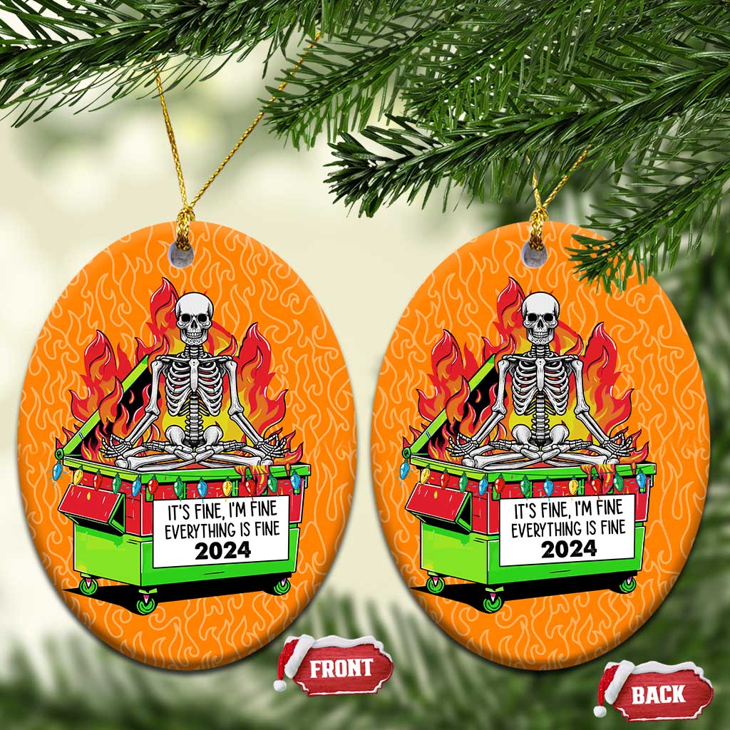 Two orange circle Christmas ornaments with skeleton-in-flames dumpster design and front/back tags