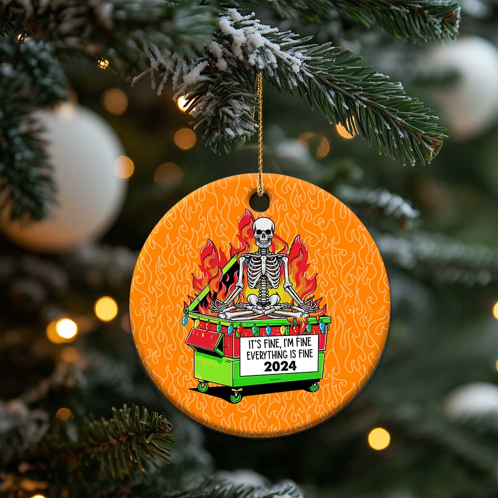 Orange circle Christmas ornament hanging from a branch, skeleton-in-flames dumpster artwork