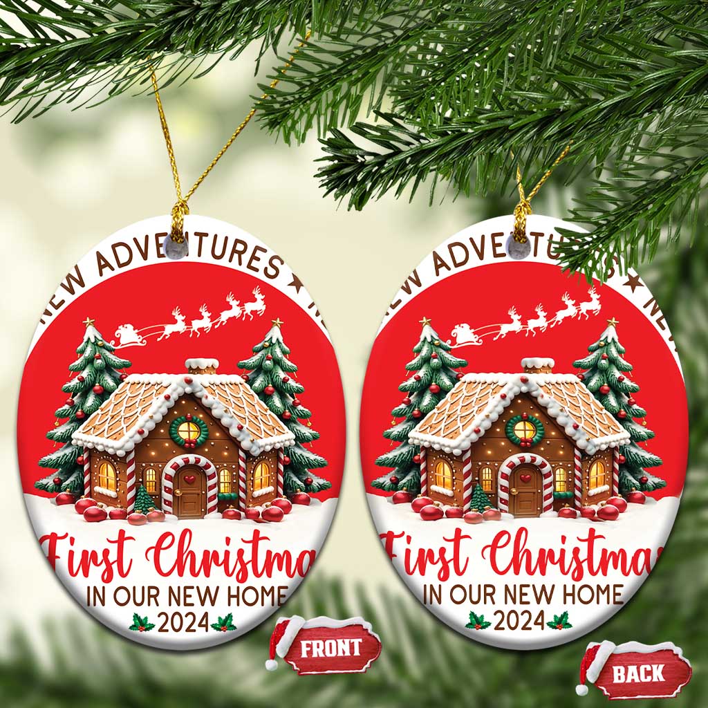 Two red round Christmas ornaments hanging on branches, featuring a decorated house and “First Christmas 2024”.