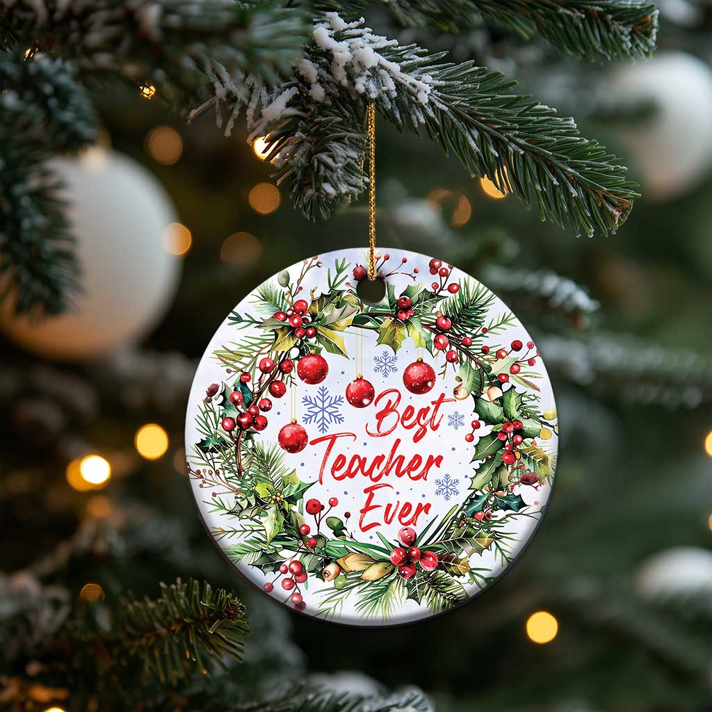 Round Christmas ornament showing “Best Teacher Ever” with pine branches, red berries, hanging loop