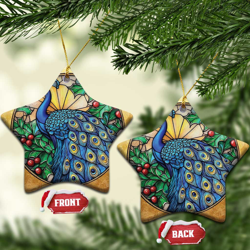 Two gold star-shaped peacock bird ornaments with blue feathers and red berry accents