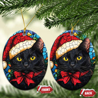 Oval Christmas ornaments with black cat Santa hat and red bow, gold hanging loops