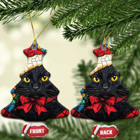 Bell-shaped Christmas ornament with black cat in Santa hat and red bow, gold hanging loop