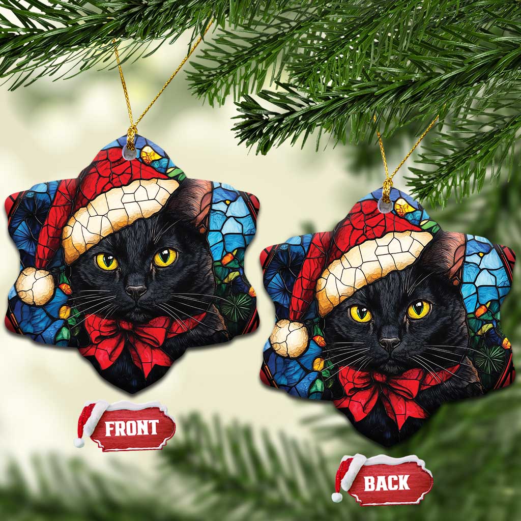 Two heart ornaments with black cat in Santa hat and red bow, each with gold hanging loop