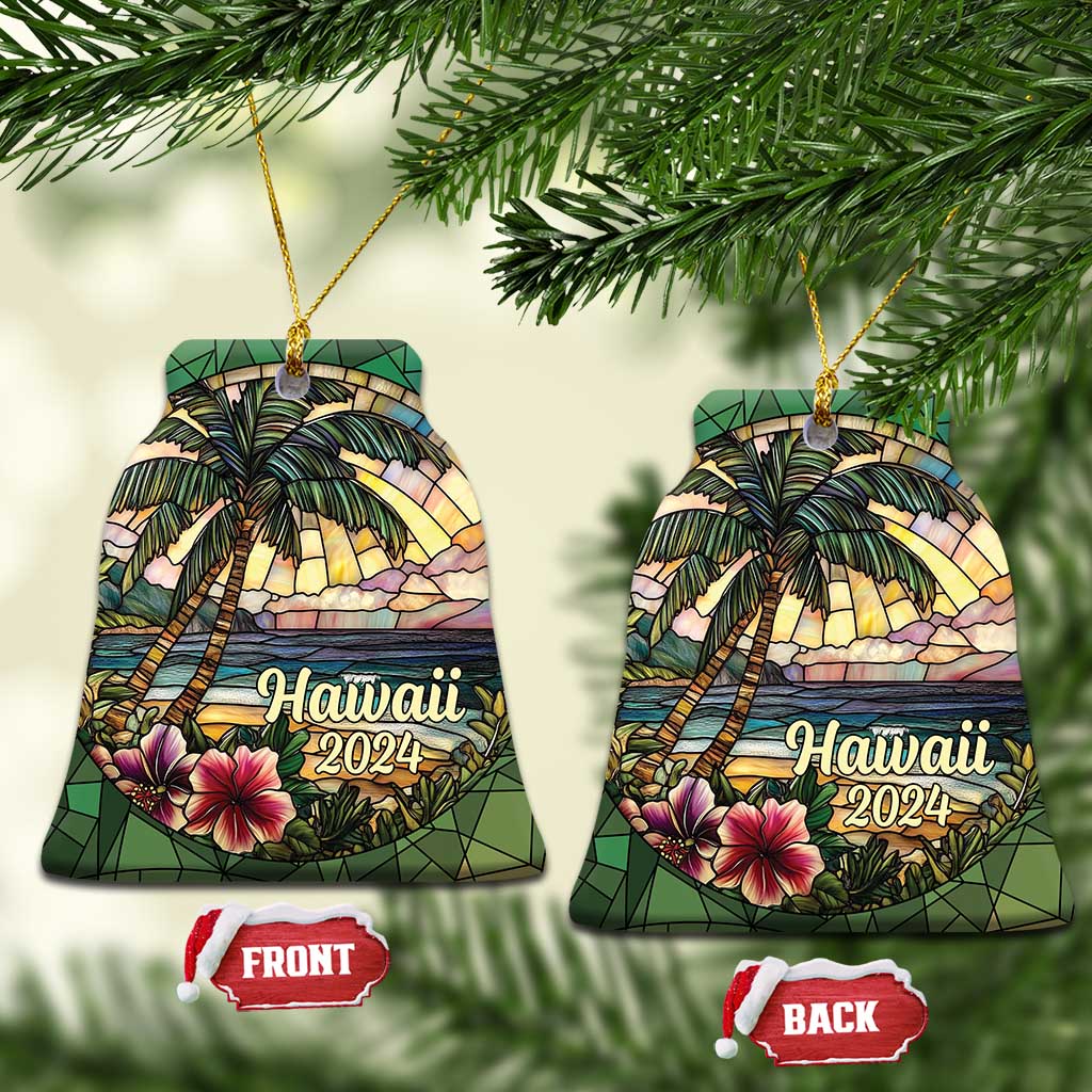 Two Hawaii 2024 bell-shaped ornaments with palm trees, ocean waves, and hibiscus