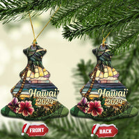 Two Hawaii 2024 bell-shaped ornaments hanging from gold cords, front and back shown