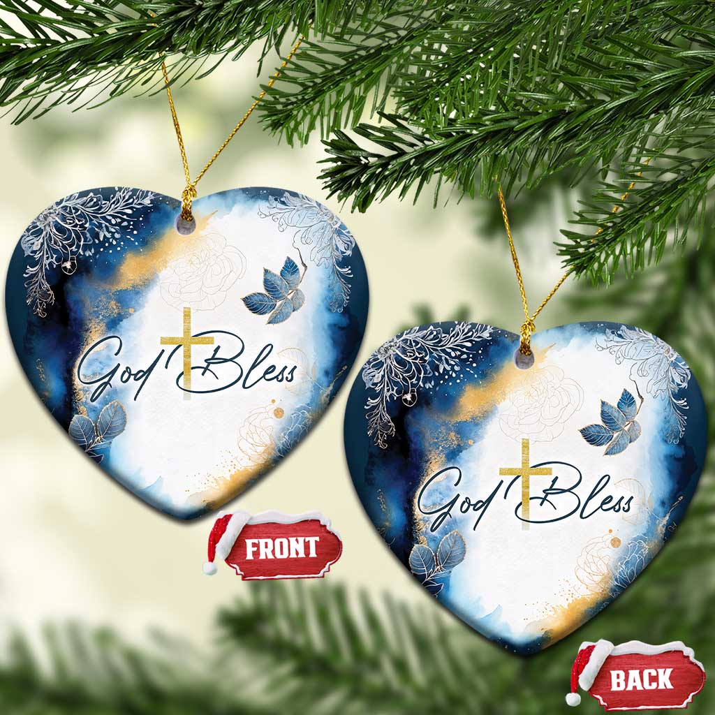 Blue and white heart-shaped Christmas ornament with gold cross and God Bless text