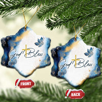Blue and white star-shaped hanging ornament with gold cross and God Bless lettering