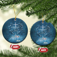 Blue round Christmas ornaments with cross and 'Christmas begins with Christ' wording