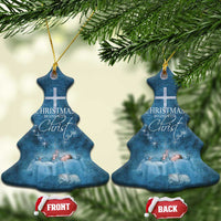 Blue Christmas tree-shaped ornaments with cross and 'Christmas begins with Christ' wording