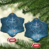 Blue star-shaped ornament with cross and 'Christmas begins with Christ' text