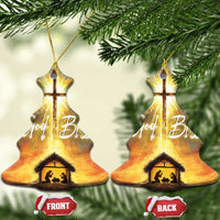 Set of two Christmas tree-shaped nativity ornaments with glowing cross, “God Bless,” and manger scene