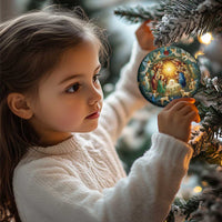 Heart-shaped nativity ornament on a Christmas tree held by a child