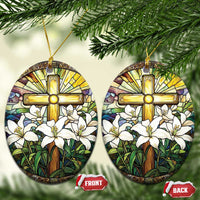 Oval stained-glass style ornament with gold cross and white lilies; gold hanging loop