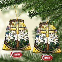 Yellow stained-glass style bell-shaped ornament with gold cross and white flowers