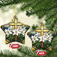 Star-shaped stained-glass style ornament with gold cross and white flowers