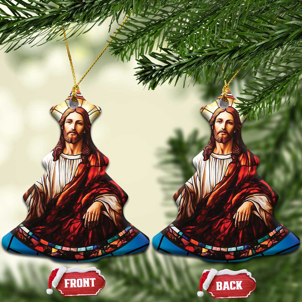 Two blue Jesus ornaments shaped like halves with stained-glass portrait, gold cords