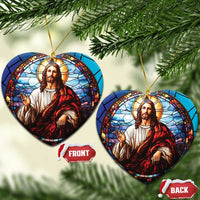 Two round Jesus ornaments with stained-glass portrait, gold cords hanging on tree