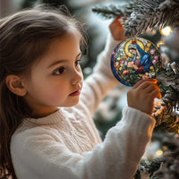 Circular Christian Christmas ornament with Mary in blue robe and colorful flowers, hanging from tree branch