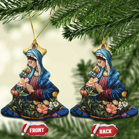 Two star-shaped Christian Christmas ornaments with Mary in blue robe and flower scene, gold loops