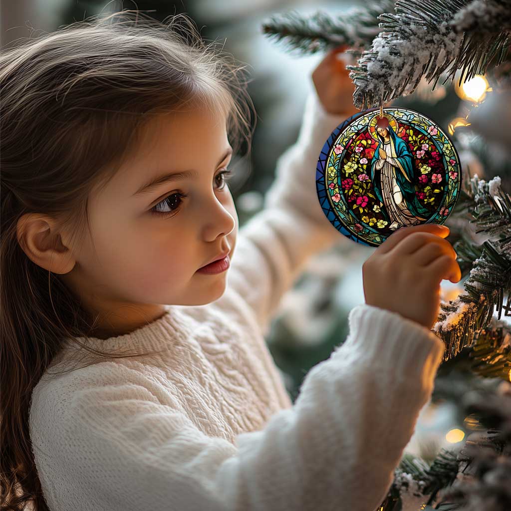 Round Mary ornament held by a child, featuring colorful floral stained-glass design