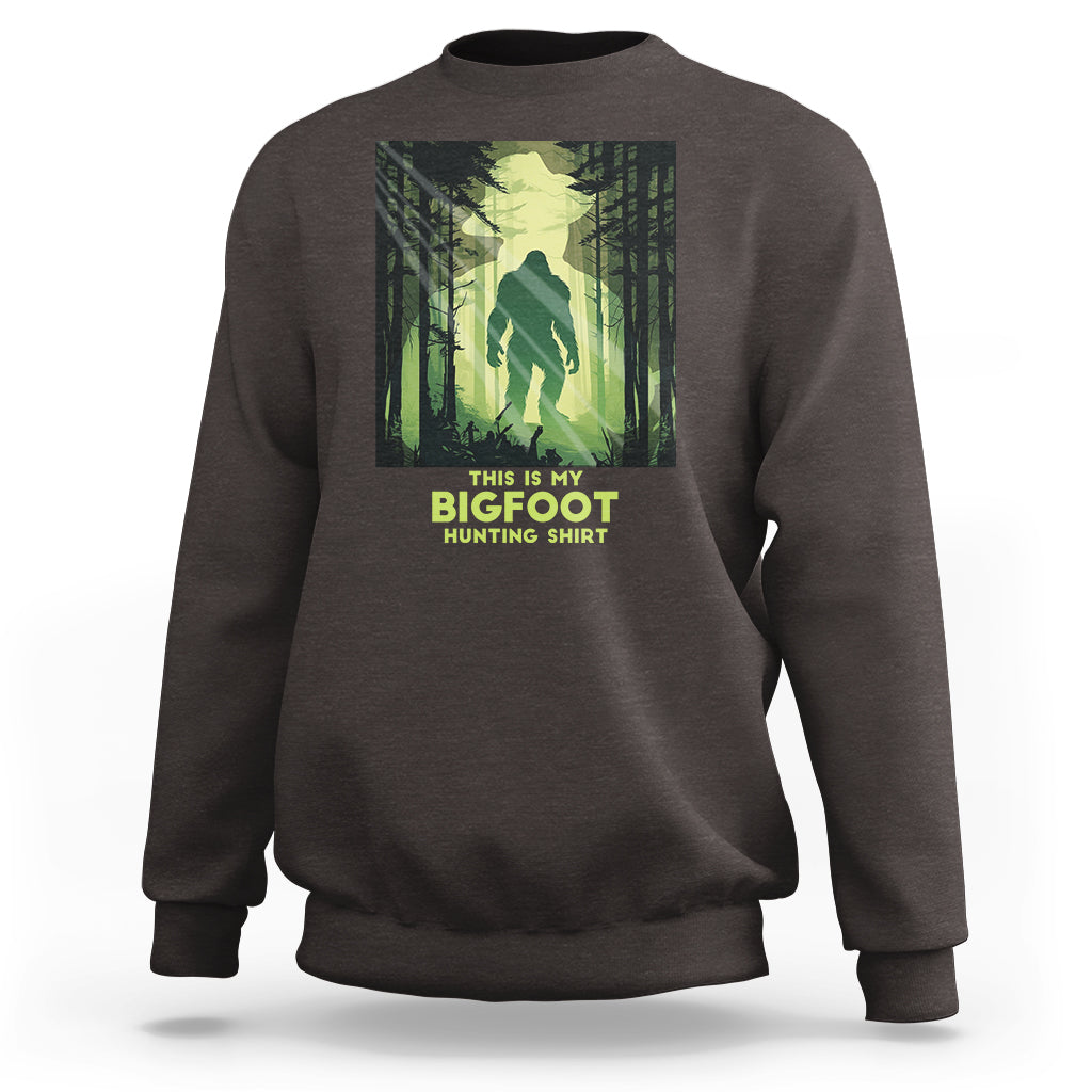 Dark chocolate brown sweatshirt with front Bigfoot hunting graphic and crew neck cuffs